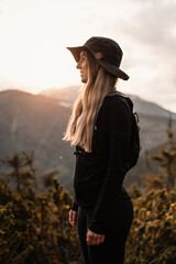 Young traveler hiking girl with backpacks. Hiking in mountains. Tourist traveler. Hiking in Slovakia mountains landscape. Low Tatras national park, Slovakia. © Zedspider