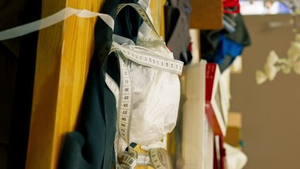 vertical video in the sewing workshop on a large work table there are all possible sewing accessories