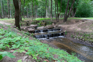 small artificial waterfall in the park.