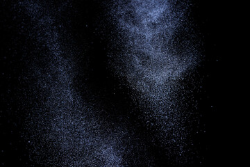 Black and blue grunge texture. Abstract splashes of water on dark background. Light clouds overlay...