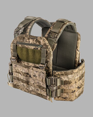 Detailed view of modern camouflage military tactical vest with MOLLE system, multiple pouches, and...
