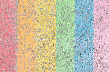 Texture of lgbtqia colors painted on the asphalt.