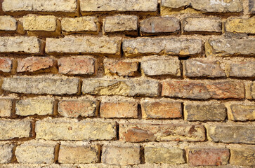old fortress wall of stones. Background of medieval brickwork for design.