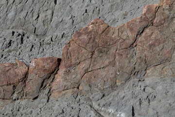 Stone texture worn by the wind and the sea of ​​the coast located on a wild beach.