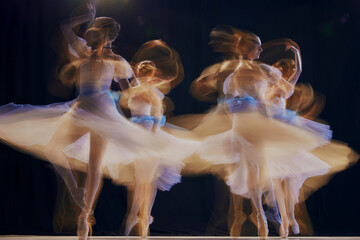 Young ballet ensemble in sheer dresses creating illusion of multiple movements against a dark...