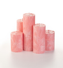 Natural pink palm wax pillar candles of varying heights; featuring unique ice pattern texture...