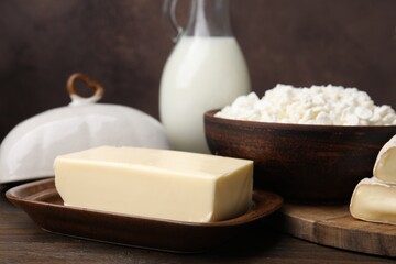 Dairy products. Cottage cheese, butter and milk on wooden table, closeup