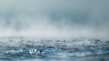 The normally clear and sparkling sea takes on a muted hazy appearance as sea smoke envelops it.