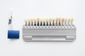  A tool for teeth whitening isolate on a gray background.