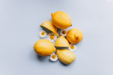 Lemons with little flowers on a blue background
