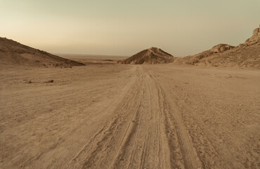 Sand track through the desert landscape in Egypt