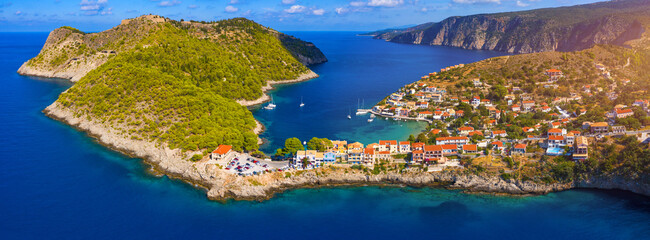 Assos village in Kefalonia, Greece. Turquoise colored bay in Mediterranean sea with beautiful...