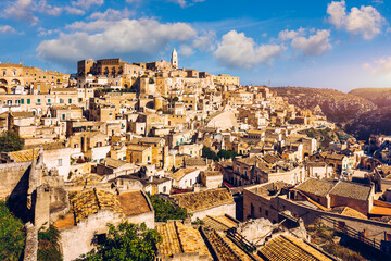 Naklejka premium Panoramic view of the ancient town of Matera (Sassi di Matera) in a beautiful autumn day, Basilicata, southern Italy. Stunning view of the village of Matera. Matera is a city on a rocky outcrop.
