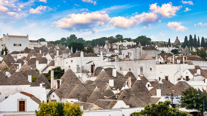 The traditional Trulli houses in Alberobello city, Apulia, Italy. Cityscape over the traditional...