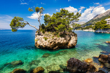 Kamen Brela symbol of the city of Brela on Adriatic coast of Dalmatia, Croatia. Kamen Brela, tiny...
