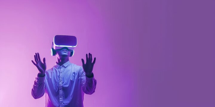 The man wearing a VR headset and gesturing with his hands.