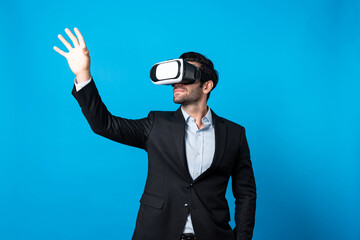 Professional smart business man holding something while wearing VR glasses. Caucasian project...