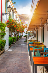 Street with blooming flowers in Puerto de Mogan, Gran Canaria, Spain. Favorite vacation place for...
