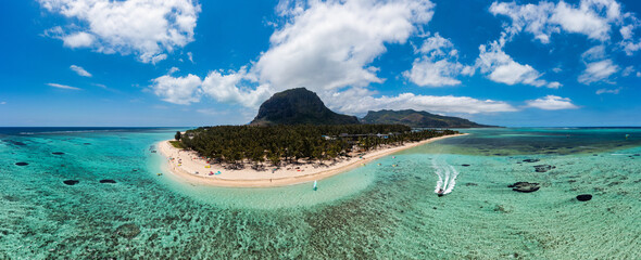 Aerial view of Le morne Brabant in Mauriutius. Tropical crystal ocean with Le Morne mountain and luxury beach in Mauritius. Le Morne beach with palm trees, white sand and luxury resorts, Mauritius.