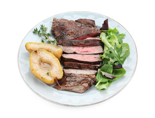 Pieces of delicious roasted beef meat, caramelized pear and greens isolated on white