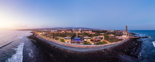 Aerial drone of the popular resort town of Meloneras, with hotels and restaurants, near the...