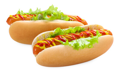 Tasty hot dogs with lettuce, ketchup and mustard isolated on white