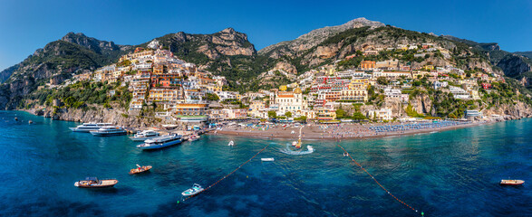 Aerial view of Positano with comfortable beach and blue sea on Amalfi Coast in Campania, Italy. Positano village on the Amalfi Coast, Salerno, Campania. Beautiful Positano, Amalfi Coast in Campania.