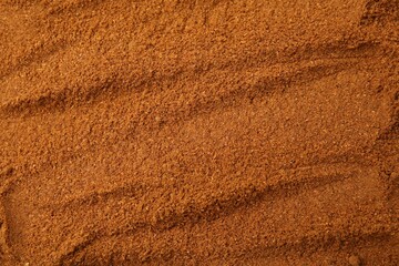 Aromatic spice. Ground red pepper as background, closeup
