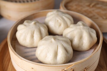Delicious bao buns (baozi) on table, closeup