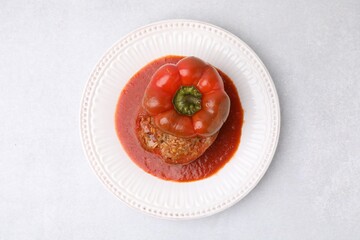Delicious stuffed bell pepper on light table, top view