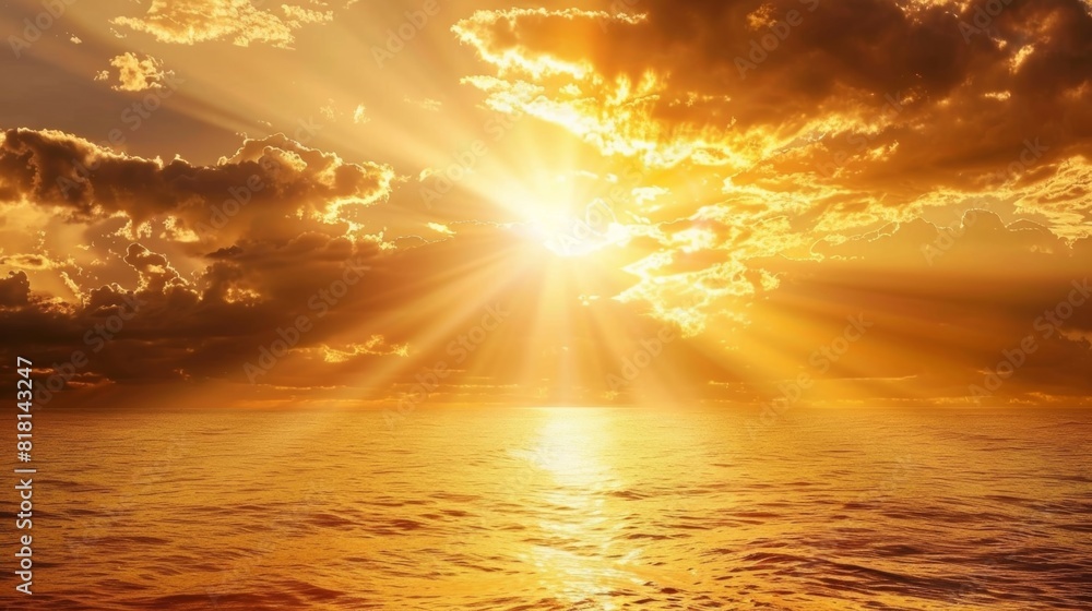 Wall mural the sun breaks through the clouds casting a brilliant beam of light down onto the ocean creating a g