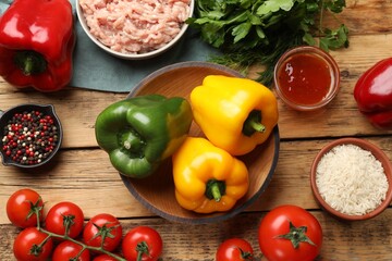 Making stuffed peppers. Vegetables and ground meat on wooden table, flat lay