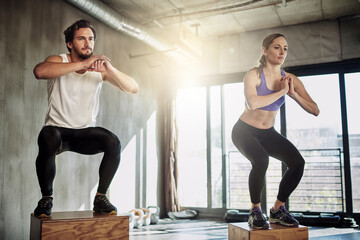 Jump, fitness and couple in training with box, power and gym for workout challenge together. Man,...