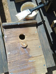 Varnishing of a Handmade Birdhouse
