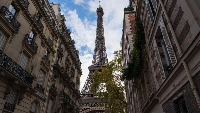Timelapse of the Eiffel Tower Paris city morning sunrise to daytime Sunny and clear sky riverside bay view bridge.