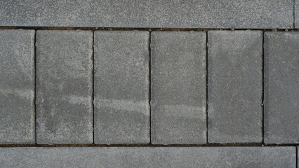 Grey paving slabs with a view from above