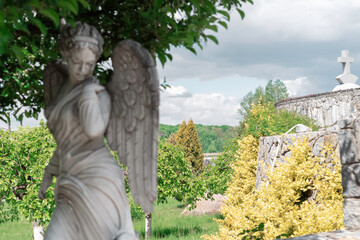 marble statue of woman angel on park background