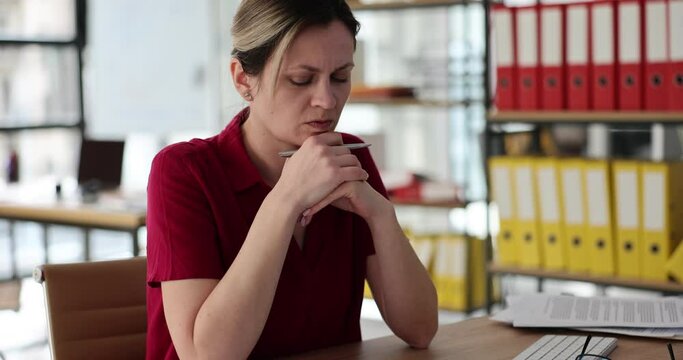 Doubting woman worker hesitates looking in different directions in company office. Employee thinks about mistakes in working tasks. Problem with report slow motion