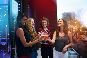 Women, friends and group toast with cocktail at pub together for celebration, event or happy hour...