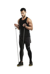Man, exercise and resistance band for workout, training and fitness in studio with strong muscle....