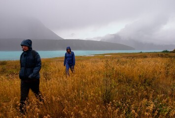 Friends Hiking In The Rain