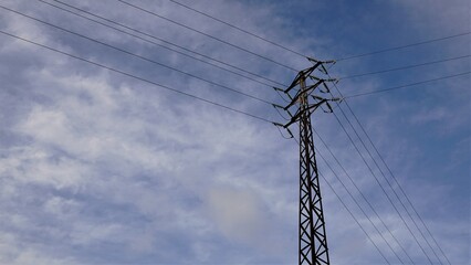 medium voltage metallic electric tower against the sky