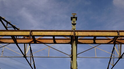 metallic geometric structure of beams against the sky