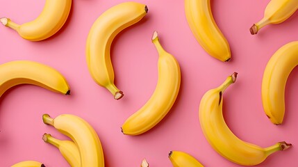 Colorful fruit pattern of fresh yellow bananas on pink background. From top view - Powered by Adobe