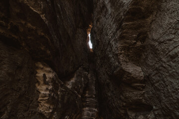 Inside view of the cave in the sandstone cliffs. The formation of sandstone in the cave.
