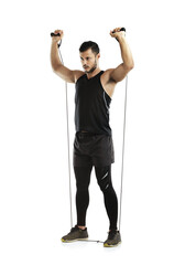 Man, studio and workout with resistance band for training or wellness, fitness and exercise for...