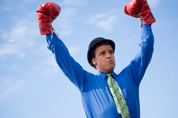 Man Wearing Derby Hat And Boxing Gloves