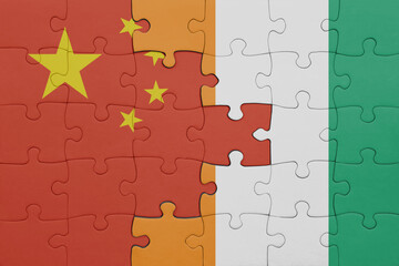 puzzle with the colourful national flag of cote divoire and flag of china .