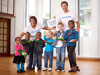 Children, portrait and food donation or volunteer organization at orphanage for nutrition, helping or non profit. Boy, girls and missionary service with thank you poster or funding, community or meal