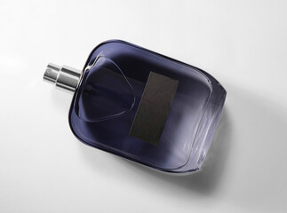 Luxury men`s perfume in bottle on white background, top view
